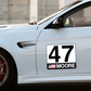 Custom race car number plate displays your race car number, driver name, and country flag. Available as permanent vinyl, reusable vinyl, and magnetic plates. SCCA and NASA compliant. Great for track cars, track days and autocross.