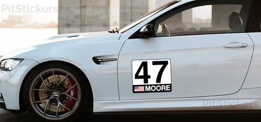 Custom race car number plate displays your race car number, driver name, and country flag. Available as permanent vinyl, reusable vinyl, and magnetic plates. SCCA and NASA compliant. Great for track cars, track days and autocross.